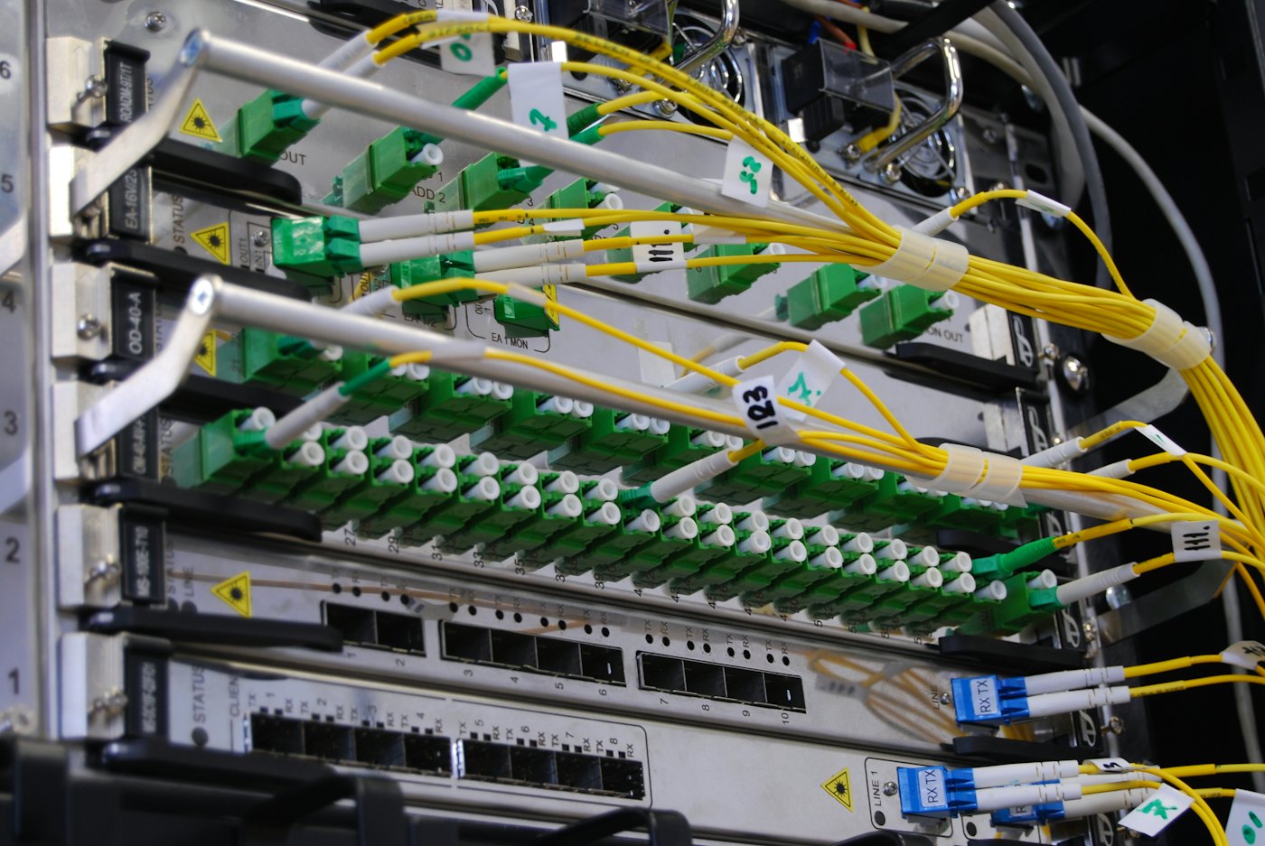 Fiber optic patch panel with yellow and green connectors